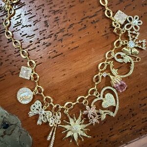 New. Never worn. Handmade Gold Charm Necklace